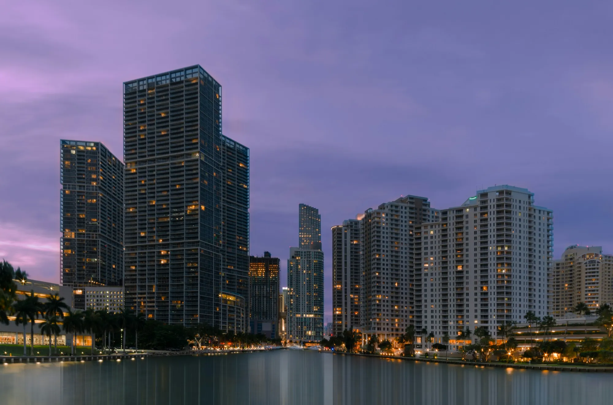 Brickell towers reflected in the water at twilight