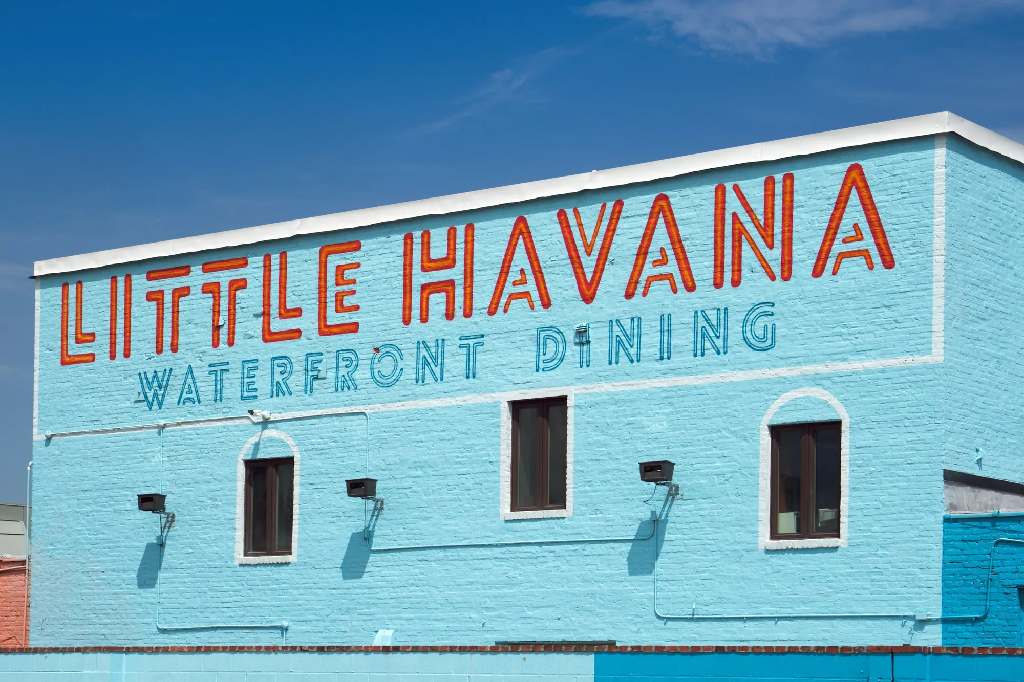 Little Havana Waterfront Dining painted across a blue building