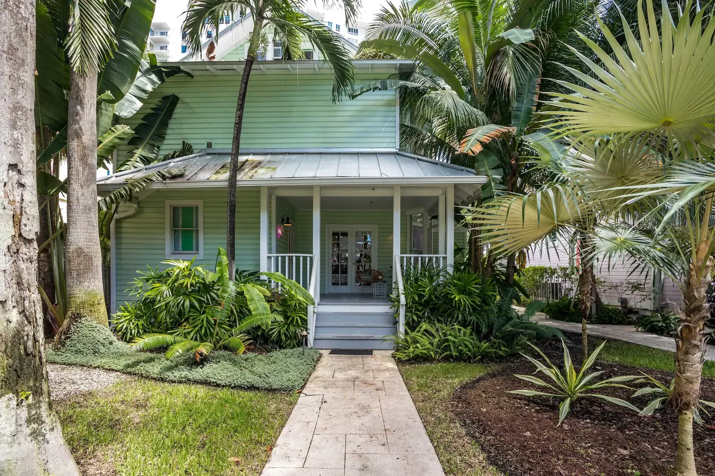 One of the restored houses at Miami 1908 behind its garden planting
