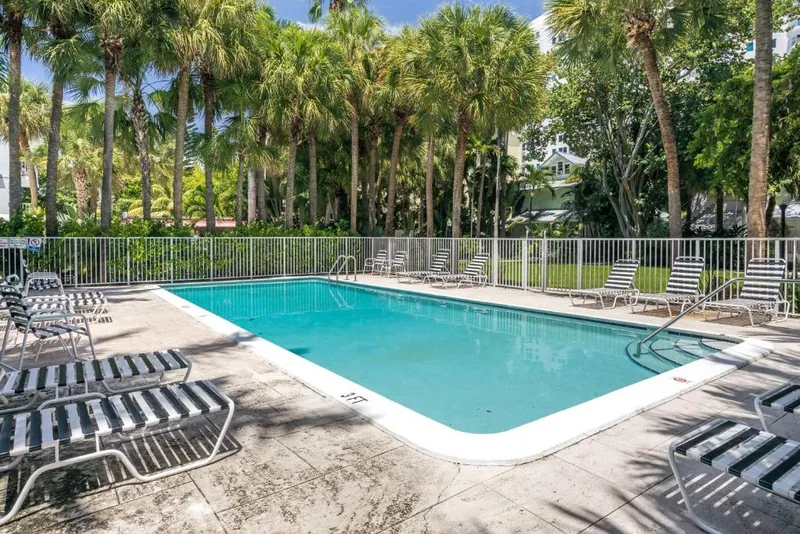The garden swimming pool surrounded by tropical planting