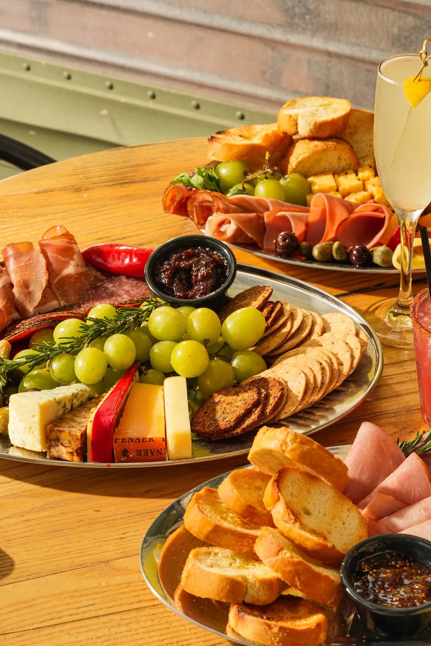 Shared boards of cheese, charcuterie and fruit on the terrace