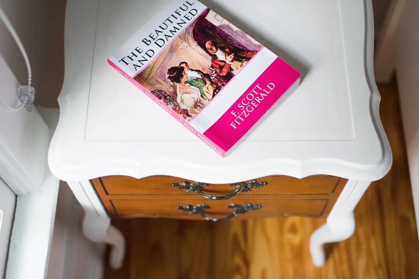 A book left open on a writing desk