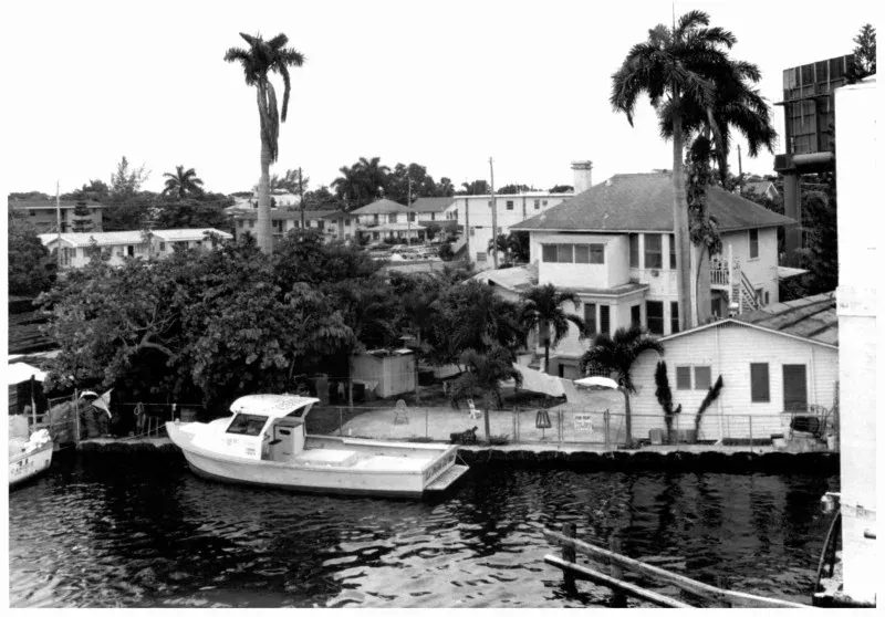 Archival photograph of the wood-frame houses above the Miami River